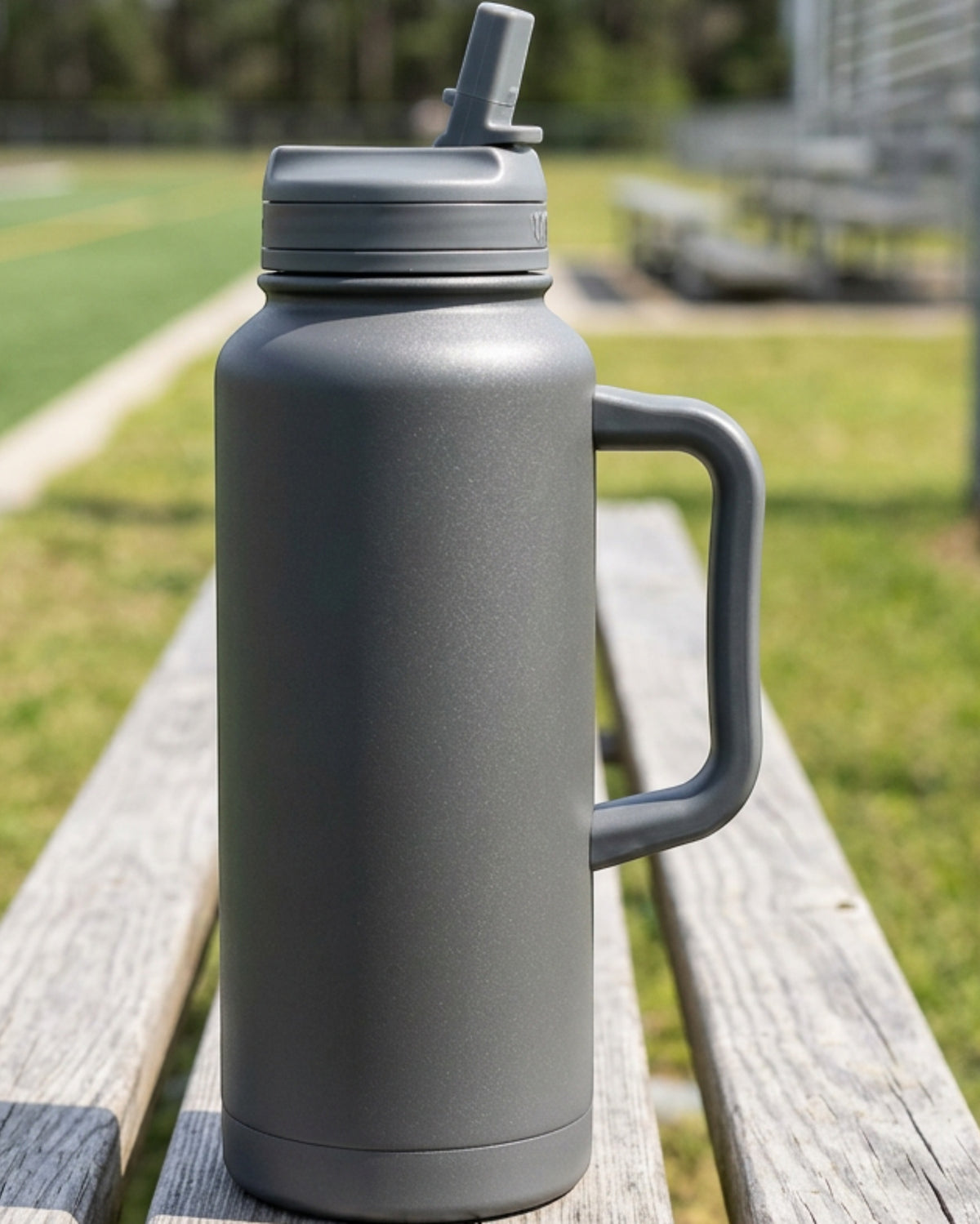 Wyvex Handled Vacuum-Insulated Sports Water Jug 40 oz Graphite Straw-Spout Lid - Lifestyle view