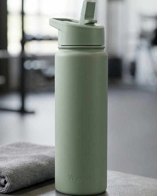 Wyvex Slim Vacuum-Insulated Sports Water Bottle 24 oz Sage Flip-Straw Lid - Lifestyle view